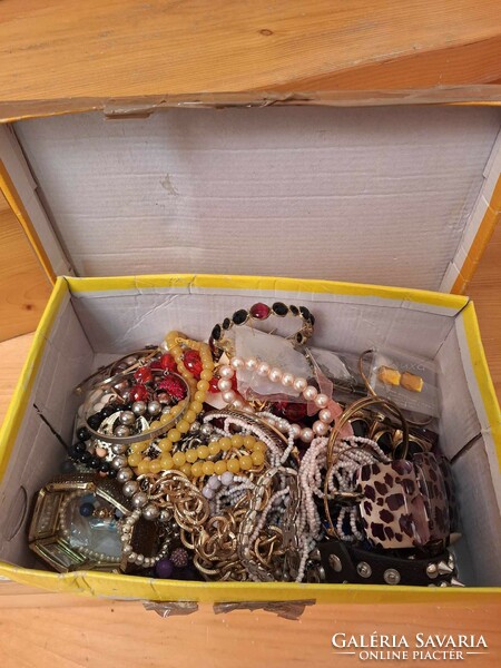 A shoebox of jewelry for sale