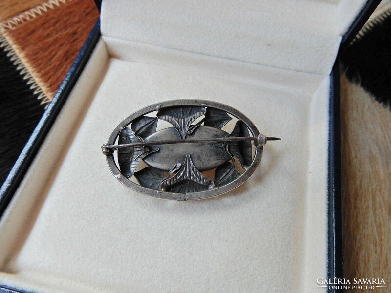 Old art nouveau style silver-plated brooch with vinyl-like stone inlay