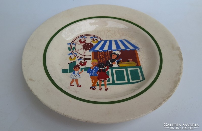 A deep earthenware plate with an old fairy tale pattern