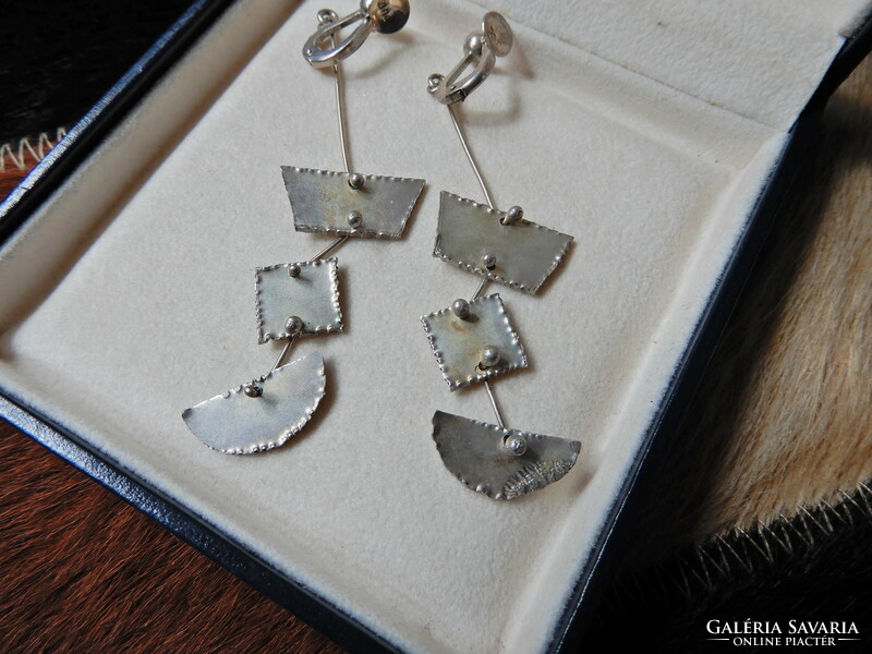 A pair of old handmade dangling silver earrings