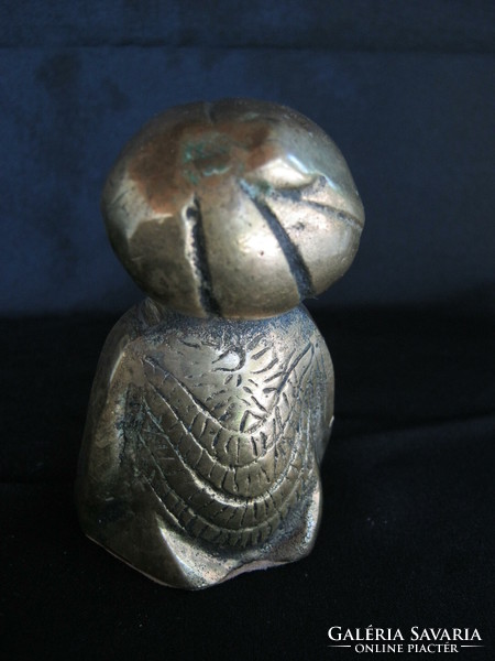 Copper figure of a praying man