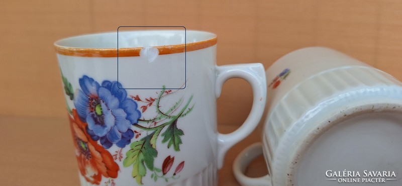 A pair of old poppy Zsolnay mugs