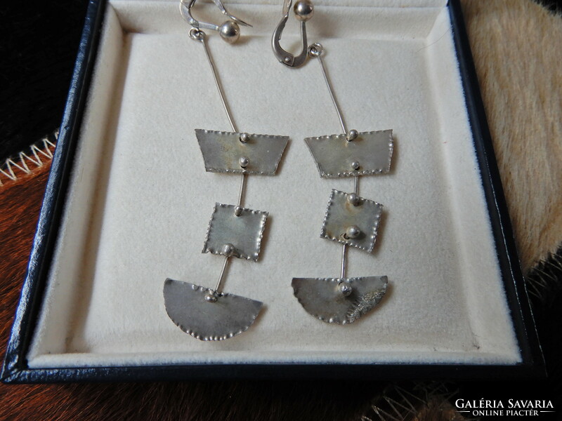 A pair of old handmade dangling silver earrings