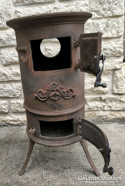 Antique rare small-sized iron stove, so-called Jancsi stove, with figural decoration. 4-Es