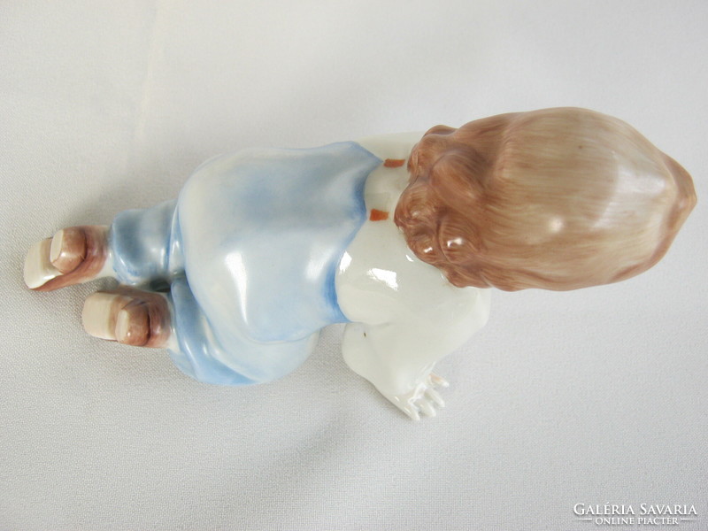 Little boy climbing Zsolnay porcelain