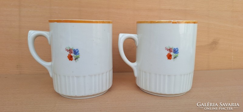 A pair of old poppy Zsolnay mugs