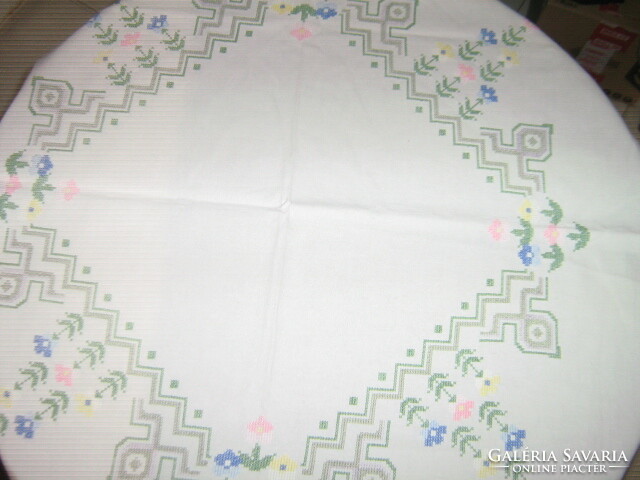 Floral tablecloth embroidered with beautiful colored crosses