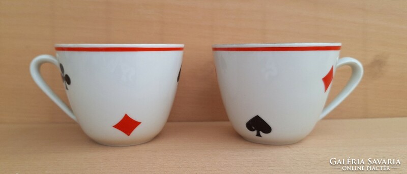 A pair of Zsolnay mugs with an old French card pattern