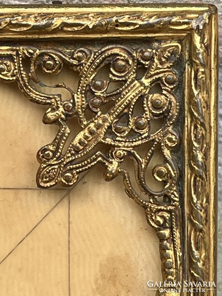 Miniature painted on bone, in a gilded filigree frame