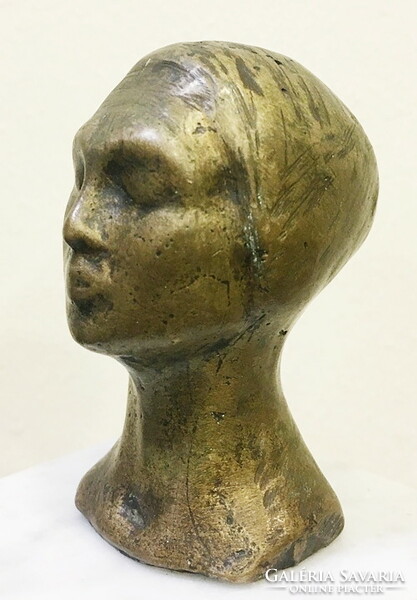 Bronze female head, on a marble base