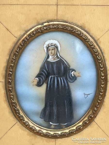 Miniature painted on bone, in a gilded filigree frame