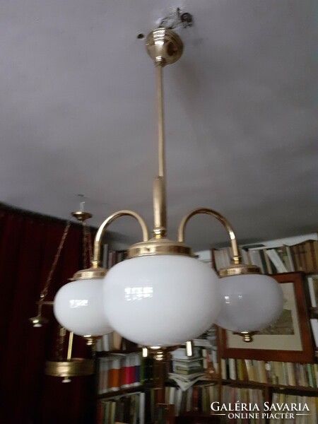 Art deco three-pronged copper chandelier with milky white shades