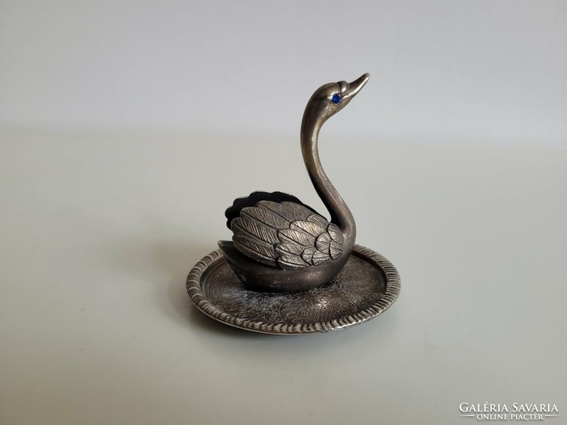 Old metal ornament in the shape of a swan