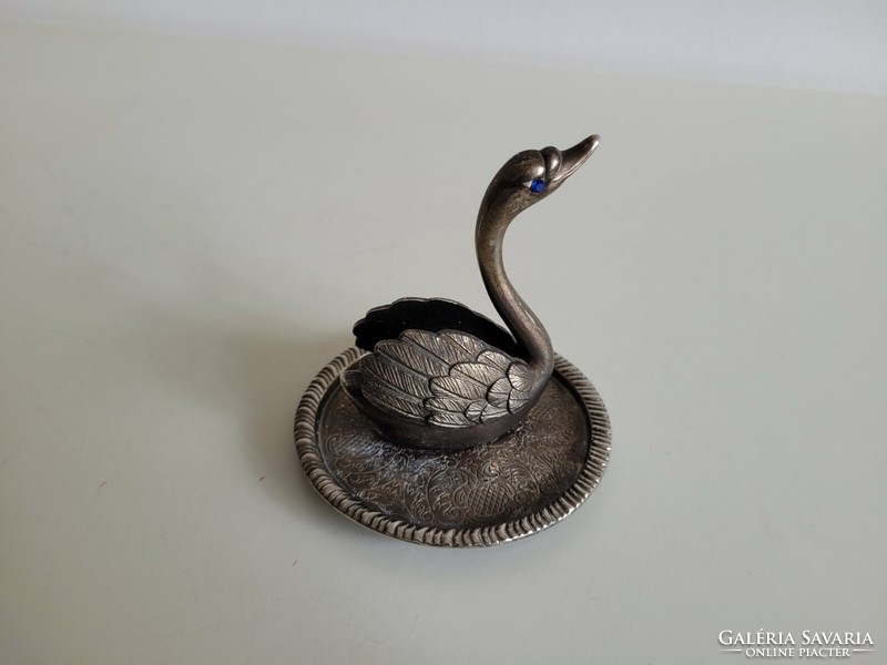 Old metal ornament in the shape of a swan