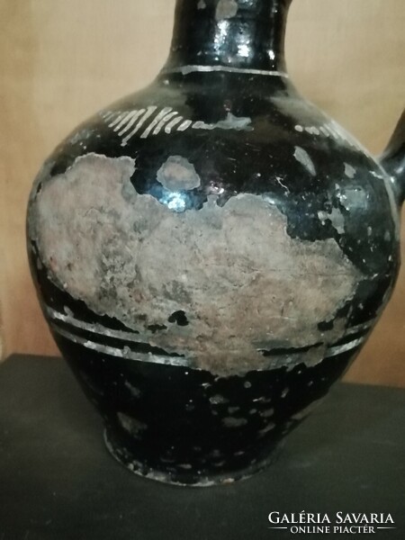 Antique black ceramic jug