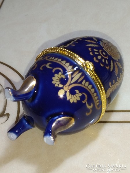 Beautiful cobalt blue gold flower patterned porcelain jewelry box in the shape of an egg