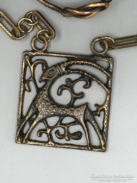 Applied art bronzed metal horoscope Aries or Capricorn pendant on a chain