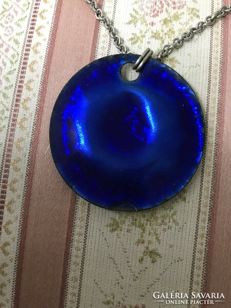 Crafted by a craftsman, a royal blue fire enamel pendant with a matching fire enamel clip