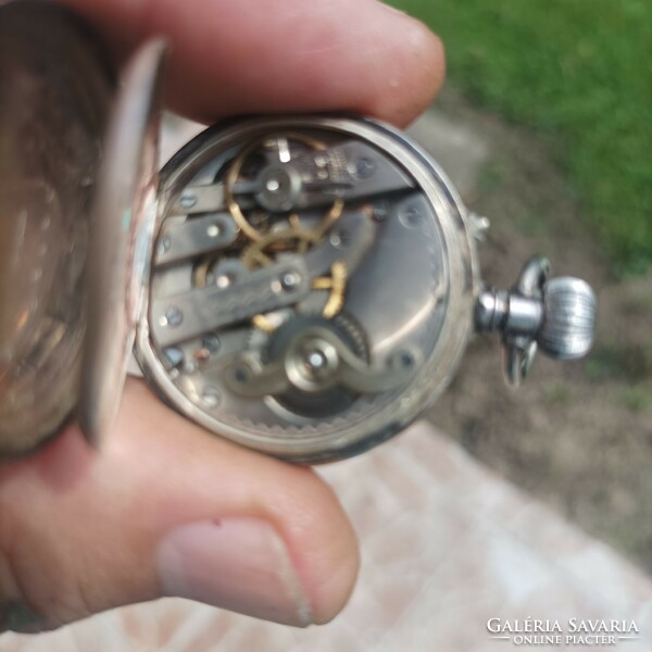 Silver pocket watch.