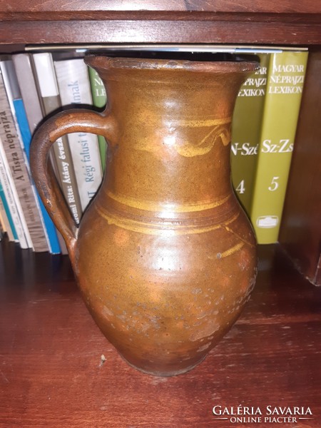 Glazed earthenware milk jug, guard