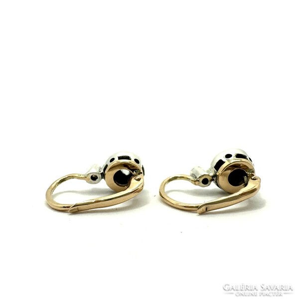 Old 14 carat gold stud earrings with diamonds!