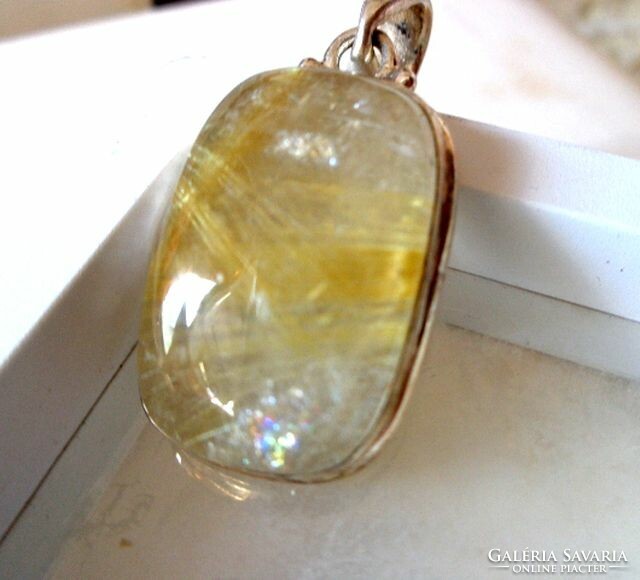 Silver rutile quartz pendant with gold pins and rainbow