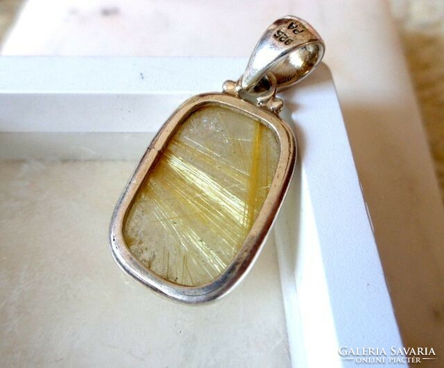 Silver rutile quartz pendant with gold pins and rainbow