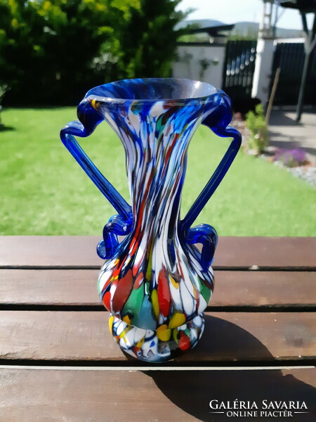 The old Murano style glass vase is damaged