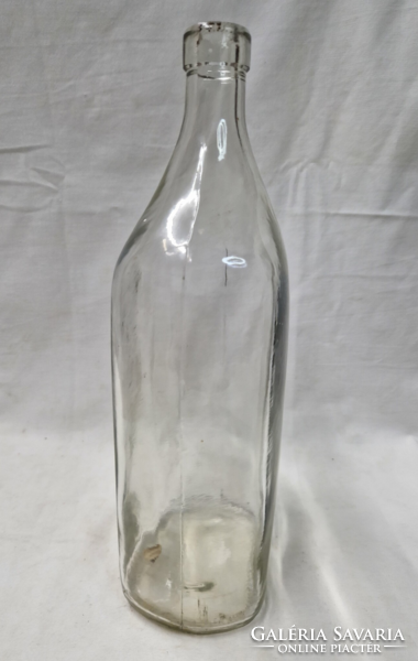 Old thick-walled two-liter bottle with a stopper, with the inscription 