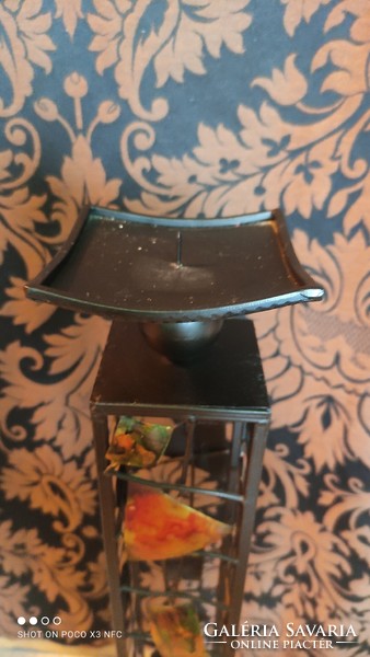 A gorgeous large standing metal design candle holder