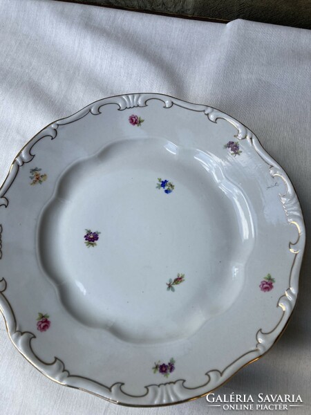 4 flat 3 deep Zsolnay porcelain plates with small flowers.