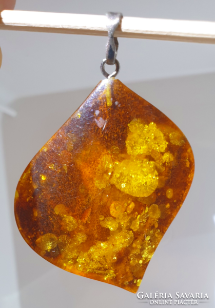 Old amber pendant with marked silver hanger