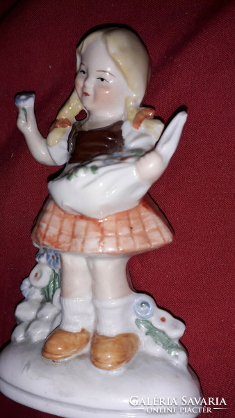 Antique German sitzendorf porcelain figure of a girl picking flowers 13 cm according to the pictures