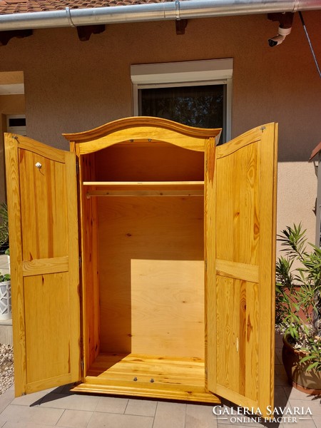 A pine cupboard with shelves and hangers from Sziged is for sale. Furniture is in good condition, completely made of pine