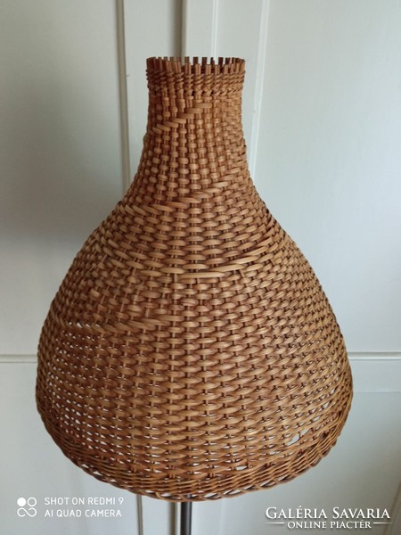 Mid-century floor lamp with a wicker shade
