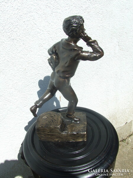 Bronze statue of a large student