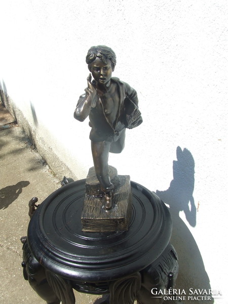 Bronze statue of a large student