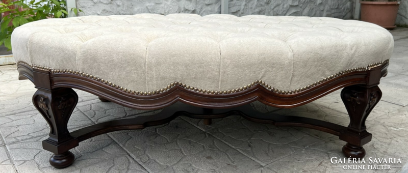 Large oval ottoman, pouffe, seat on carved legs, with buttoned seat