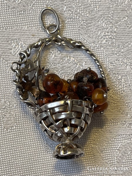 Beautiful silver basket with amber quills inside.