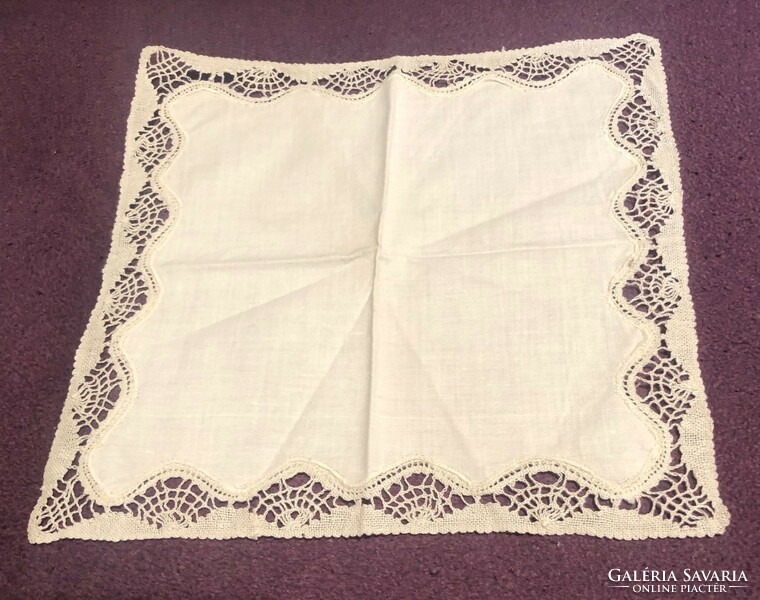 A beautiful, old decorative handkerchief with a lace edge
