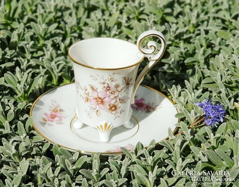 Coffee cup and saucer standing on beautiful legs