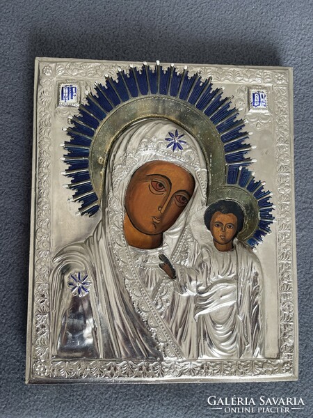 A wonderful larger hand-painted icon with a metal plaque with a prominent enameled gloria.