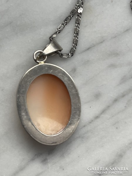 Silver camea pendant on a thin silver chain, elegant and beautiful jewelry.