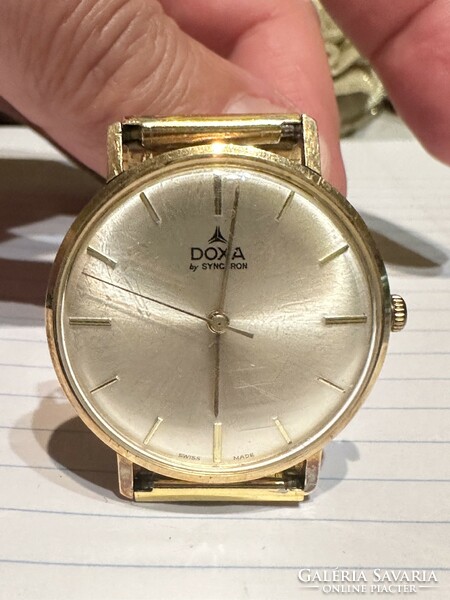 14 Kr gold doxa with beautiful strap and perfect cover for sale! Price: 150,000.-