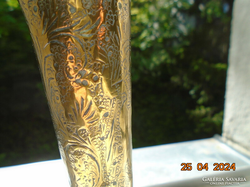 Antique gilded copper treble punched vase with Hindu deity, bird and stylized lush plant patterns