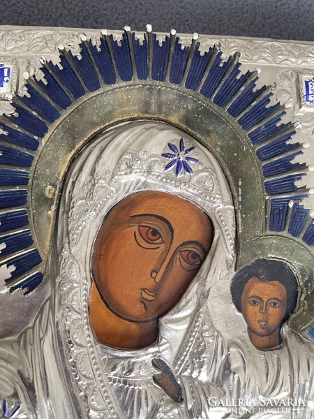 A wonderful larger hand-painted icon with a metal plaque with a prominent enameled gloria.