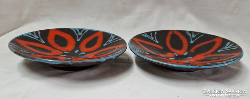 Retro applied art glazed ceramic plates or wall decorations are sold in pairs in flawless condition