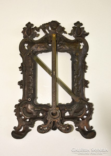 Decorative cast iron picture frame with angelic, lily motifs