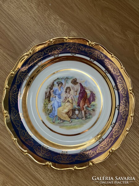 A beautiful scene richly gilded decorative plate.