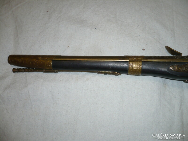 Ornate brass front-loading flintlock replica pistol